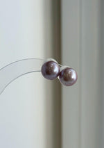 Rose lavender pearl studs shown with sterling silver posts.