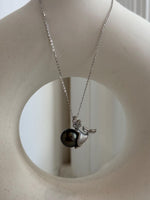Mermaid necklace featuring a lustrous dark Tahitian pearl.