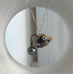 Tahitian pearl necklace with a two-tone anglerfish pendant.