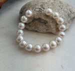 Genuine white Edison pearls paired with a sterling silver bracelet clasp.