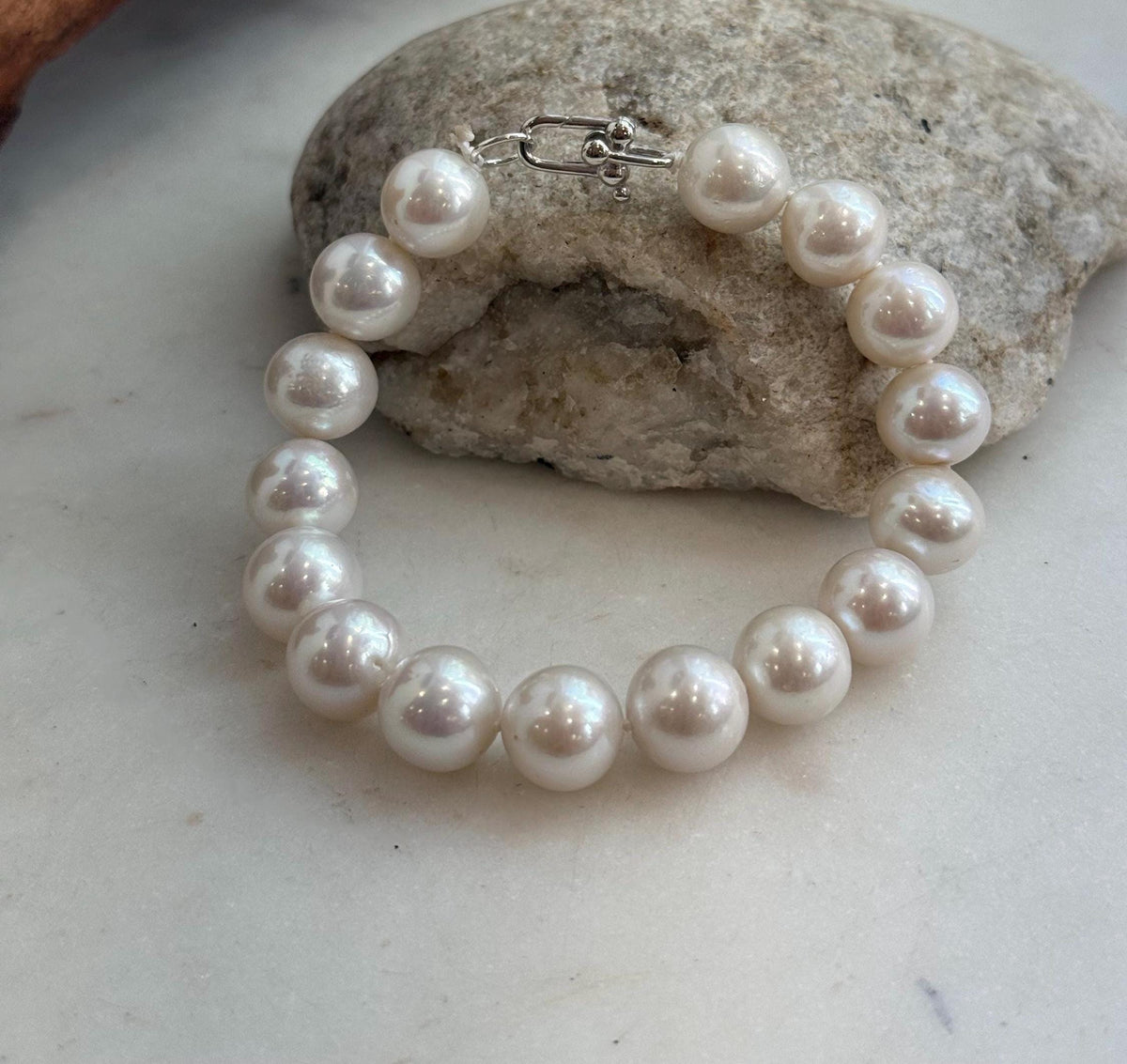 Genuine white Edison pearls paired with a sterling silver bracelet clasp.