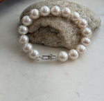 Elegant freshwater pearl bracelet with white Edison pearls and mirror luster.