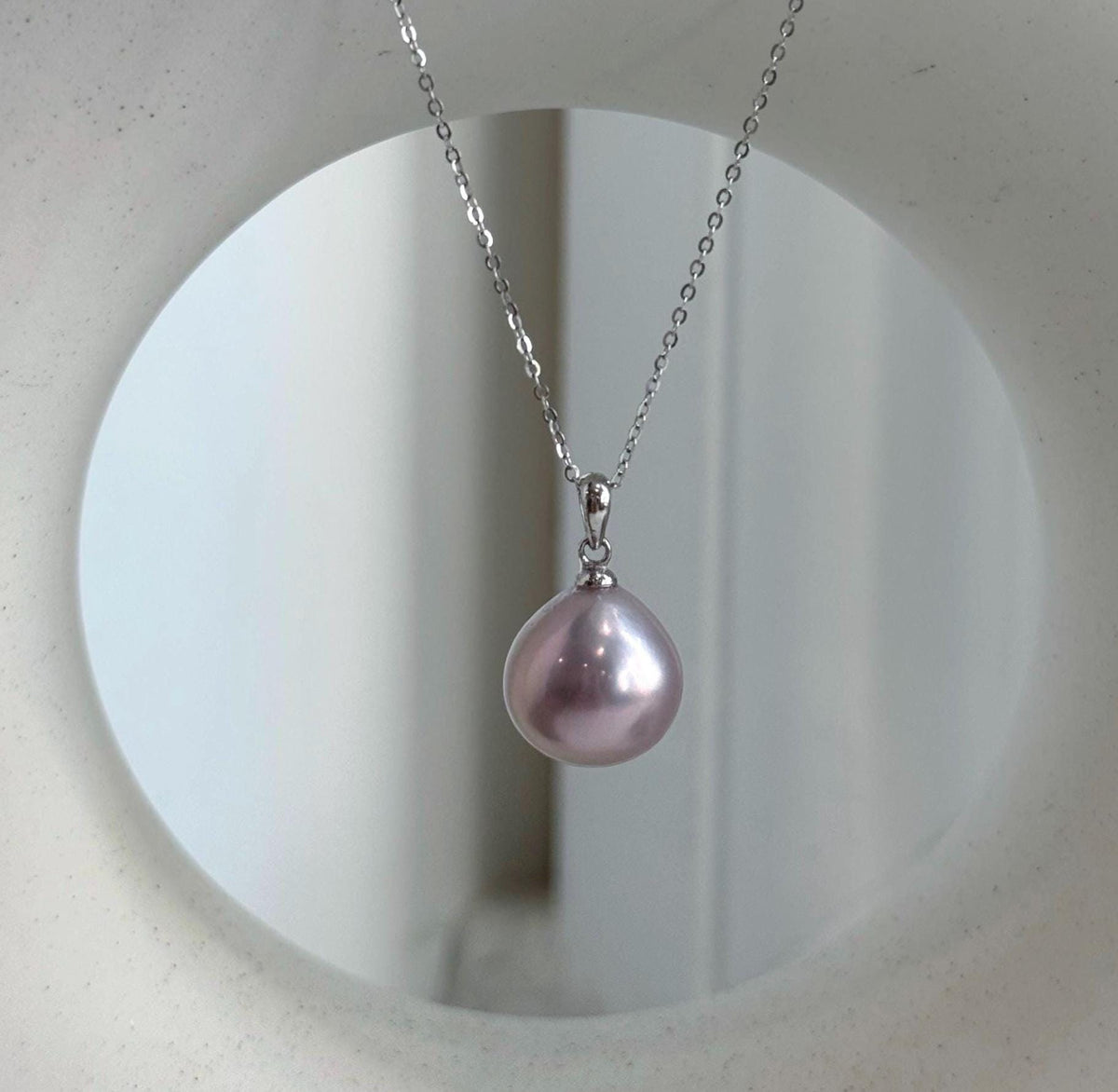 Pink freshwater pearl pendant with a simple sterling silver bail.