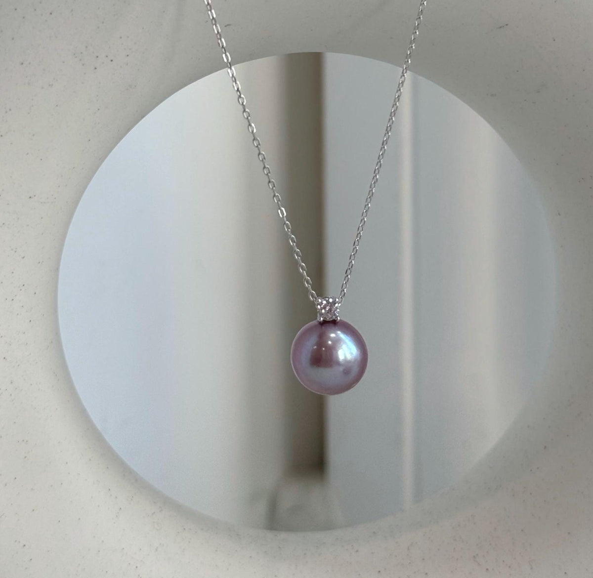 Rose lavender pearl necklace paired with sterling silver pearl studs.