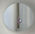 Rose lavender pearl necklace paired with sterling silver pearl studs.