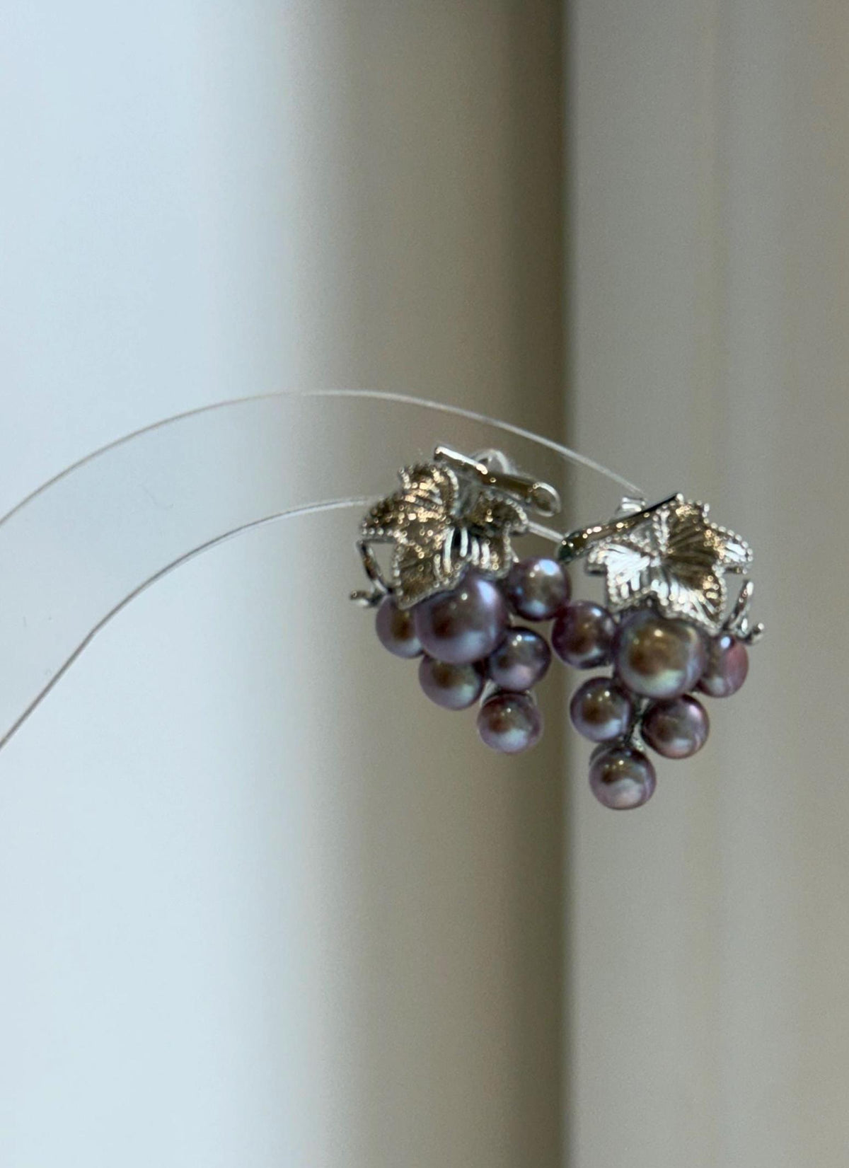 Lustrous freshwater keshi pearls arranged in delicate grape clusters.