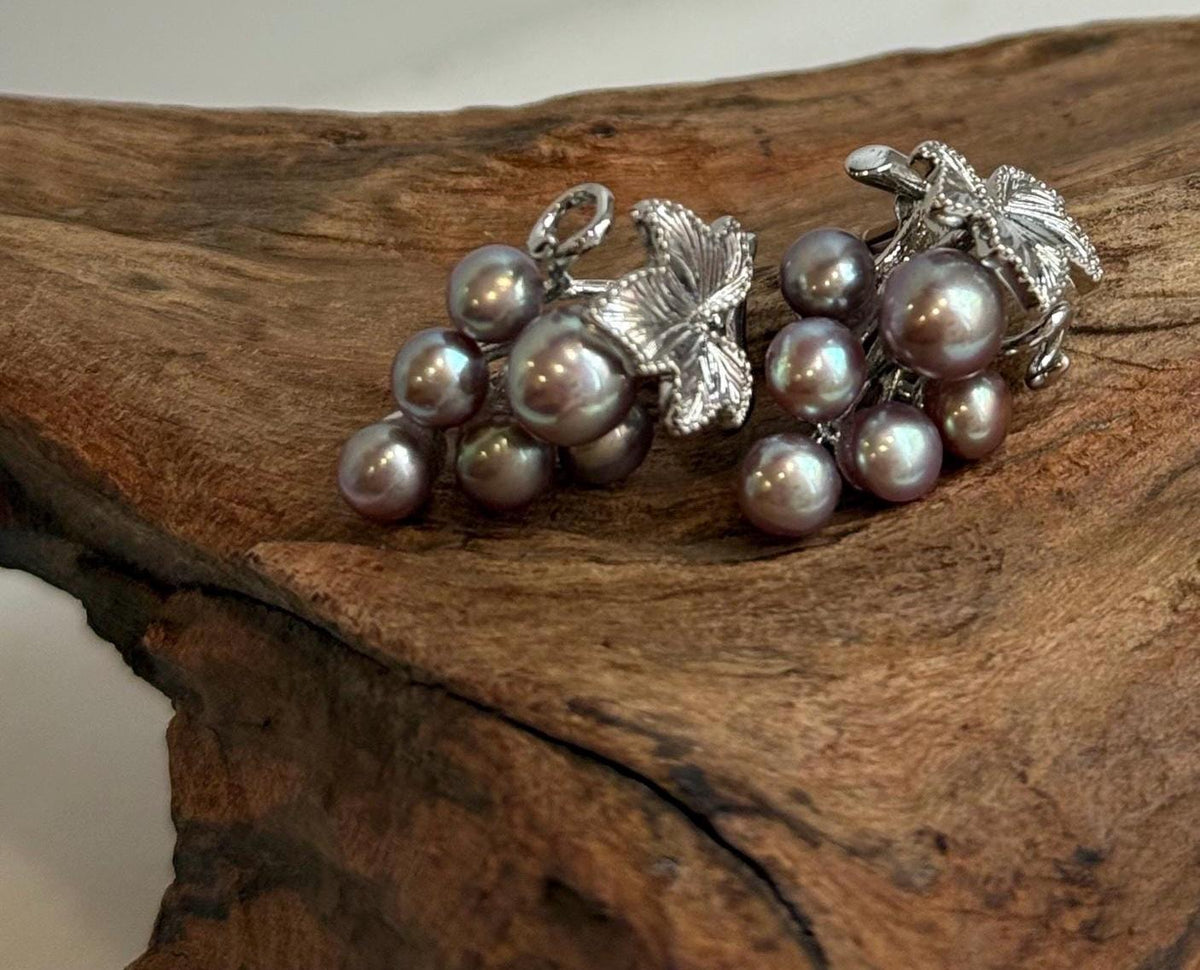 S925 silver earrings featuring genuine purple and green freshwater pearls.