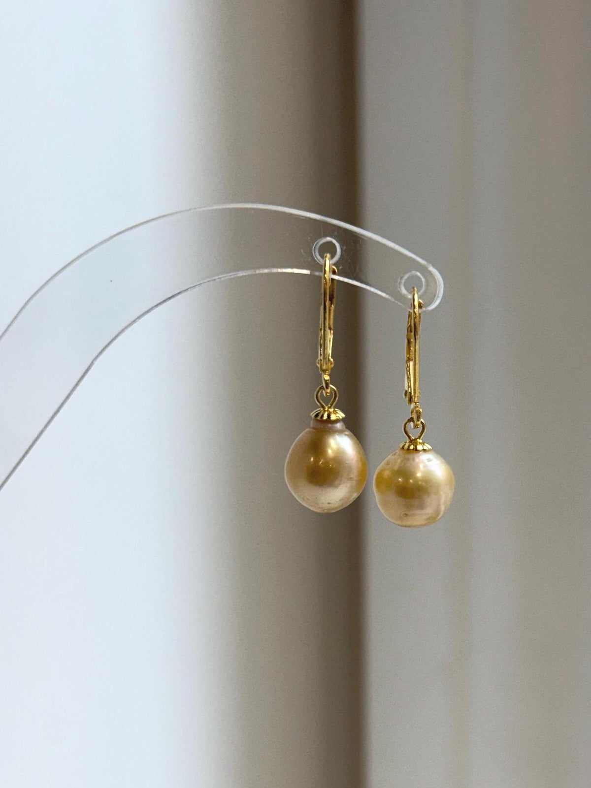Champagne gold pearl drop earrings with gold-tone S925 sterling silver leverback hooks.