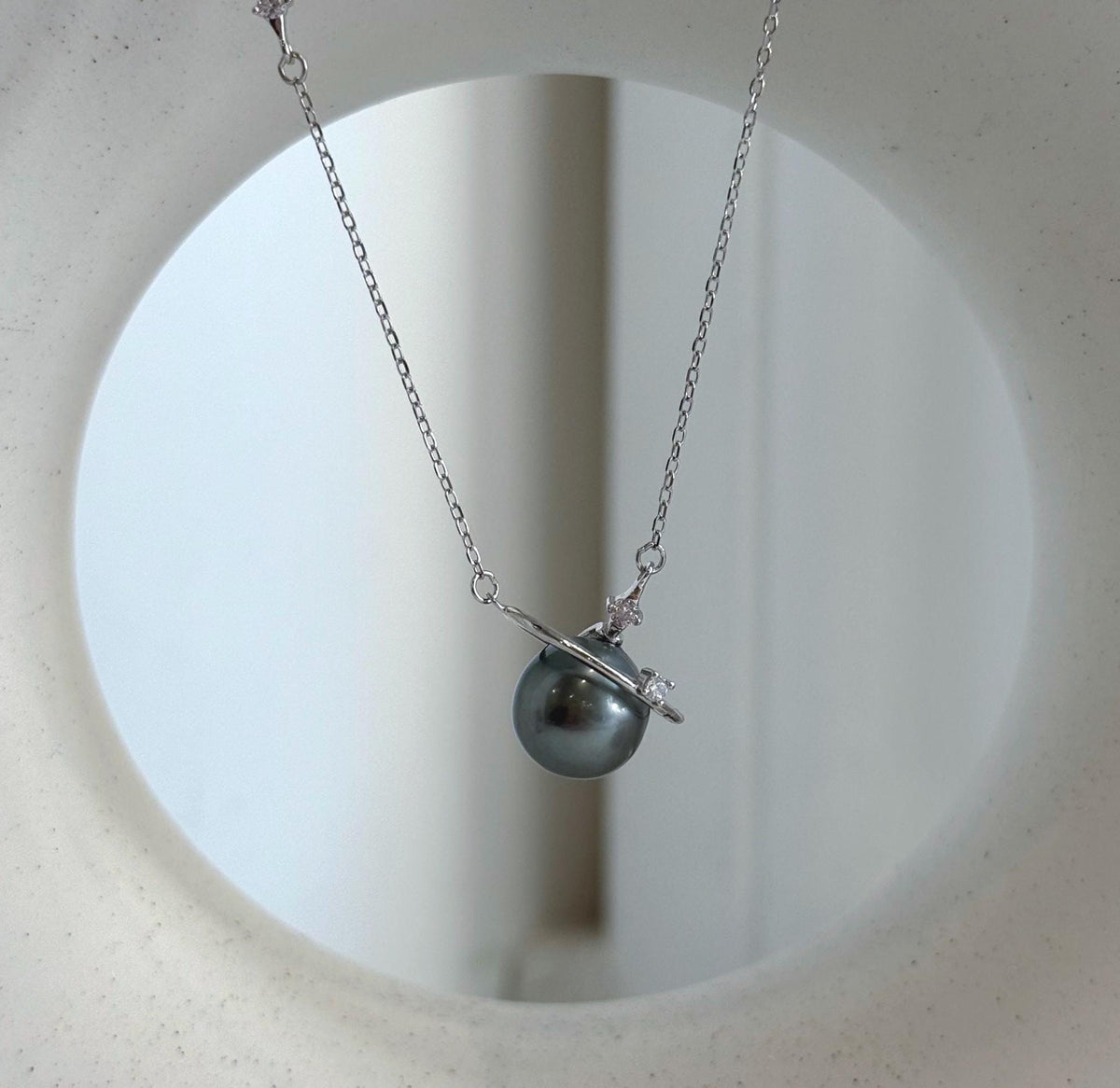 Tahitian pearl planet necklace with a silver orbit ring and sparkling star accents on a delicate S925 sterling silver chain.