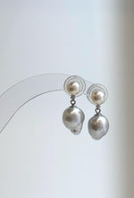 Ivory white pearl studs with dangling silver baroque pearls.