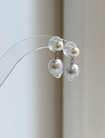 South Sea and freshwater pearls connected by small sterling silver rings.