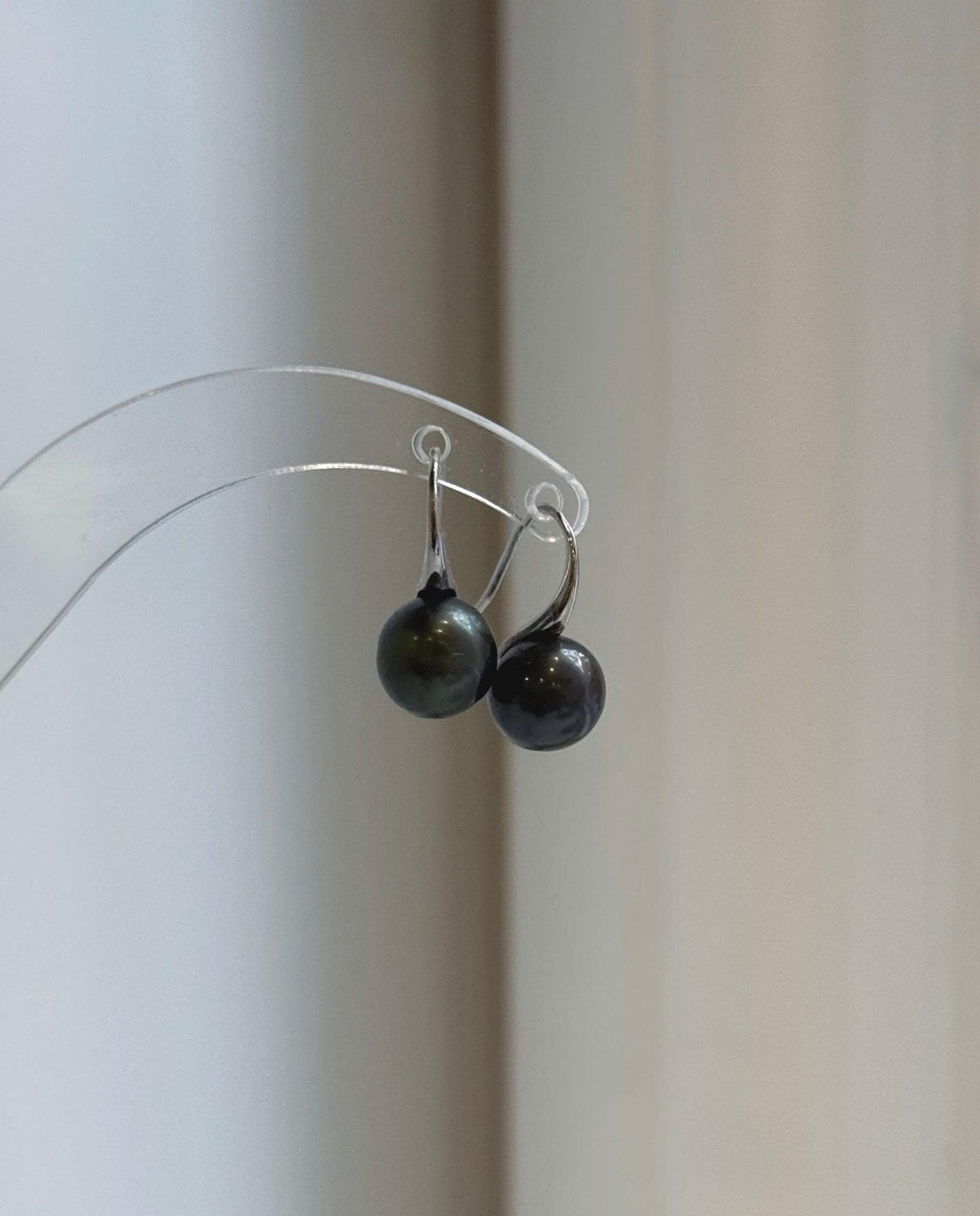 Black hunter green pearl drop earrings with curved S925 sterling silver hooks.