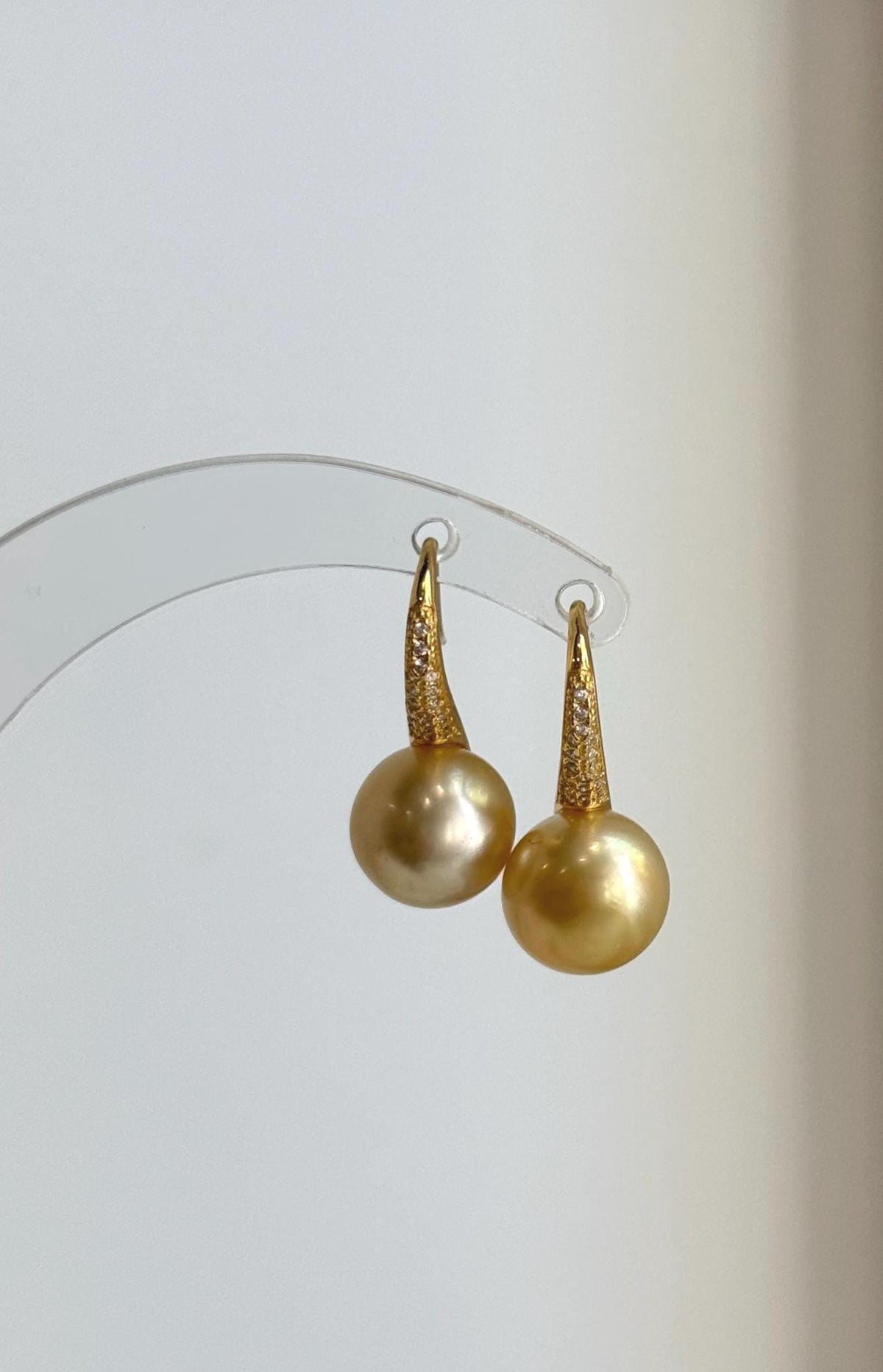 South Sea pearl earrings featuring rich golden tones and S925 sterling silver settings.