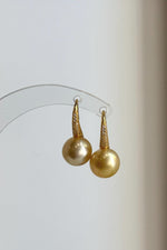 South Sea saltwater pearl earrings with high-heel inspired sterling silver hooks.
