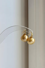 Deep tea gold South Sea pearls paired with high-heel inspired S925 sterling silver hooks.