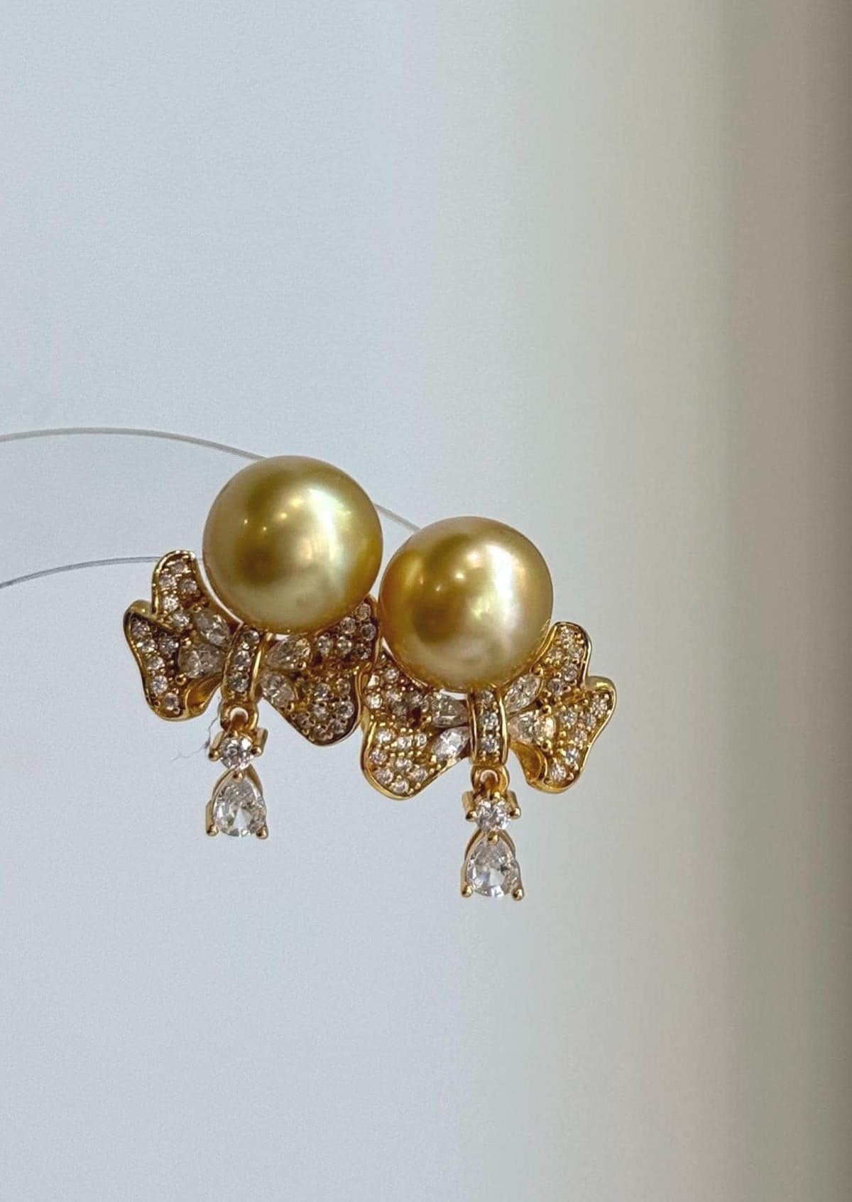 Deep tea golden South Sea pearl studs with S925 sterling silver earring jackets.