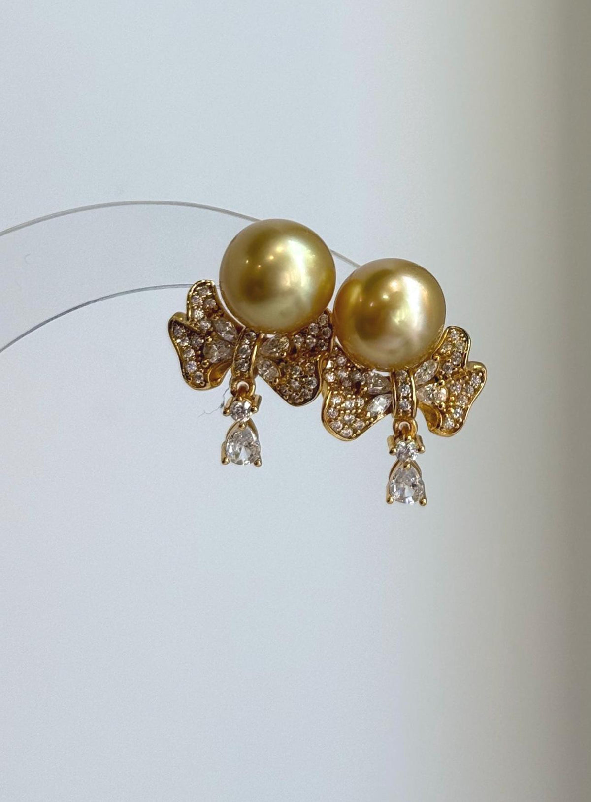 Deep golden pearl earrings with reflective luster and S925 sterling silver details.