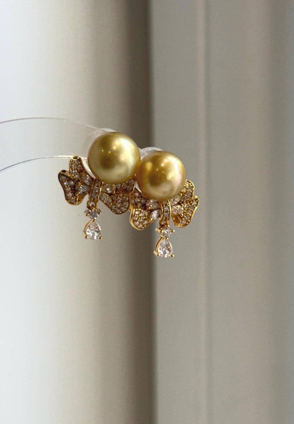 Golden South Sea pearls paired with sterling silver earring jackets.