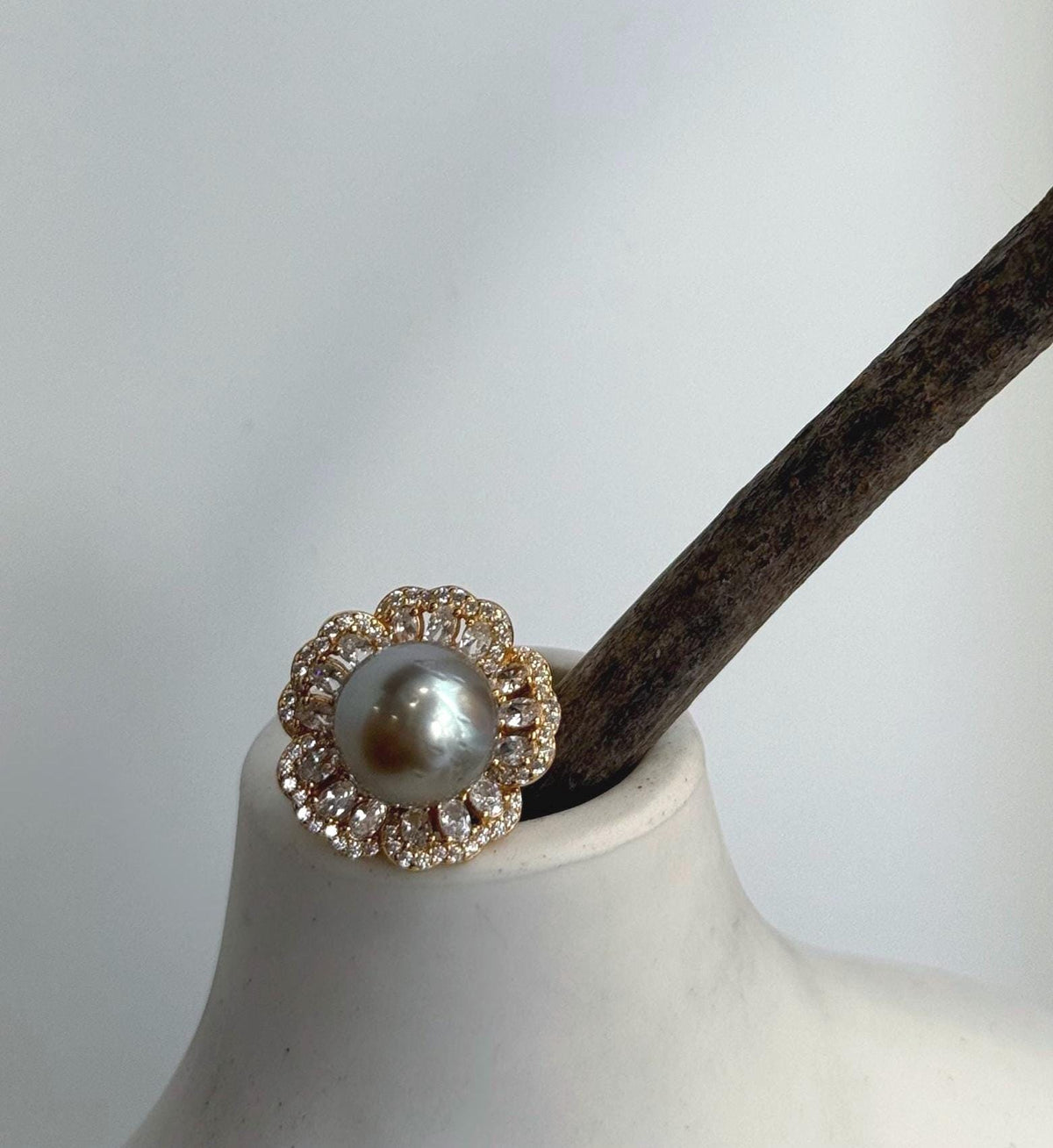 Tahitian pearl floral ring combining taupe coloring with warm gold tones.