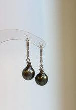S925 sterling silver earrings featuring lustrous green Tahitian saltwater pearls.