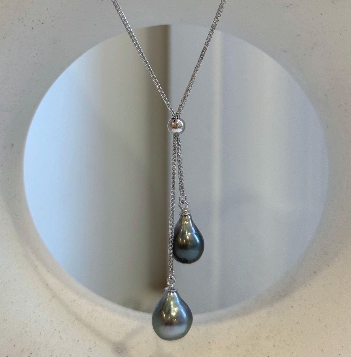 S925 sterling silver pendant and chain set featuring two Tahitian saltwater pearls.