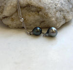 Lustrous double Tahitian pearl pendant suspended from a sterling silver chain.