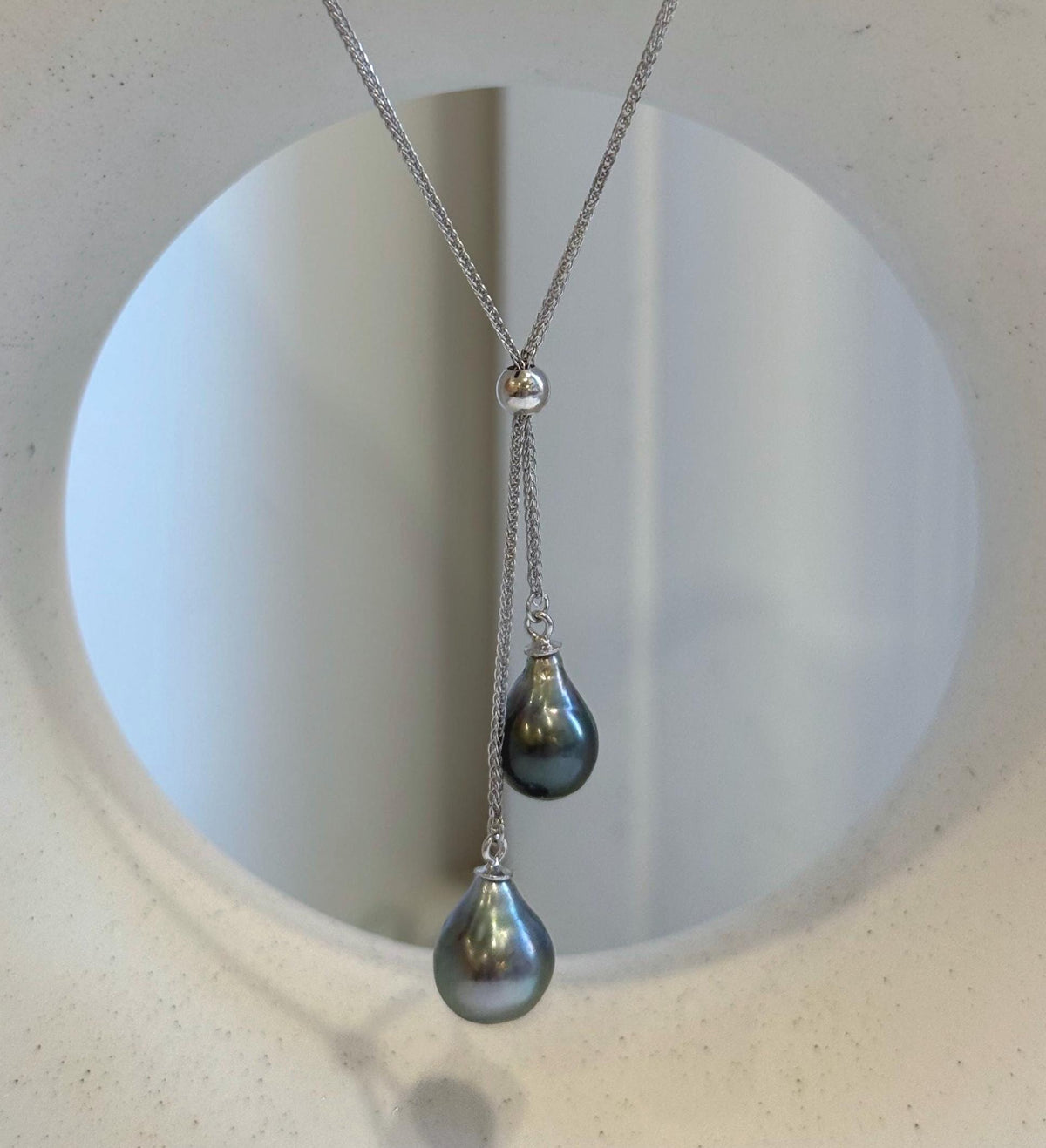 Double Tahitian saltwater pearl necklace with an S925 sterling silver setting and chain.