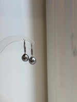 Silver hook earrings featuring dark gray pearls