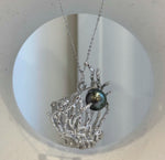 Tahitian pearl statement jewelry with a dimensional ocean-inspired design.