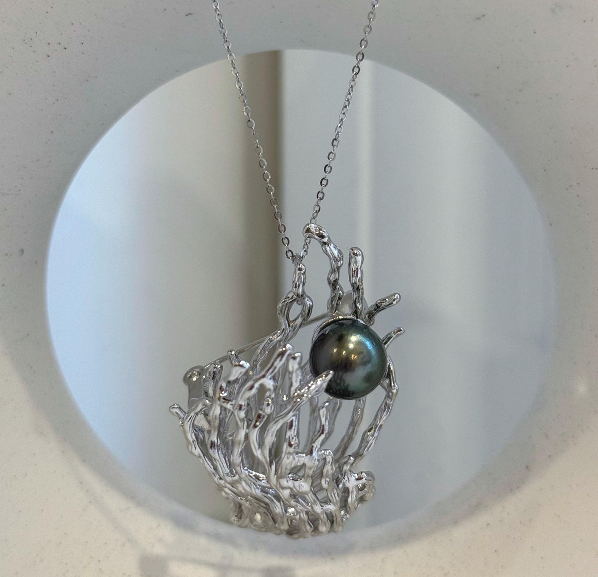 Tahitian pearl statement jewelry with a dimensional ocean-inspired design.