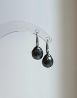 Round gray pearls suspended from sterling silver hooks