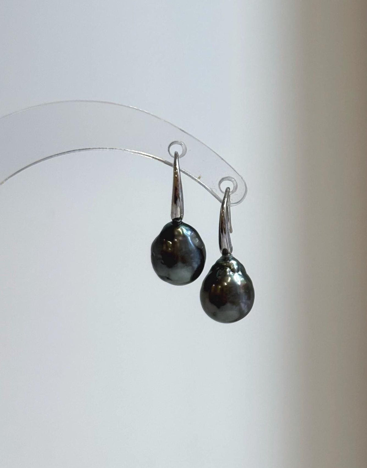 Round gray pearls suspended from sterling silver hooks
