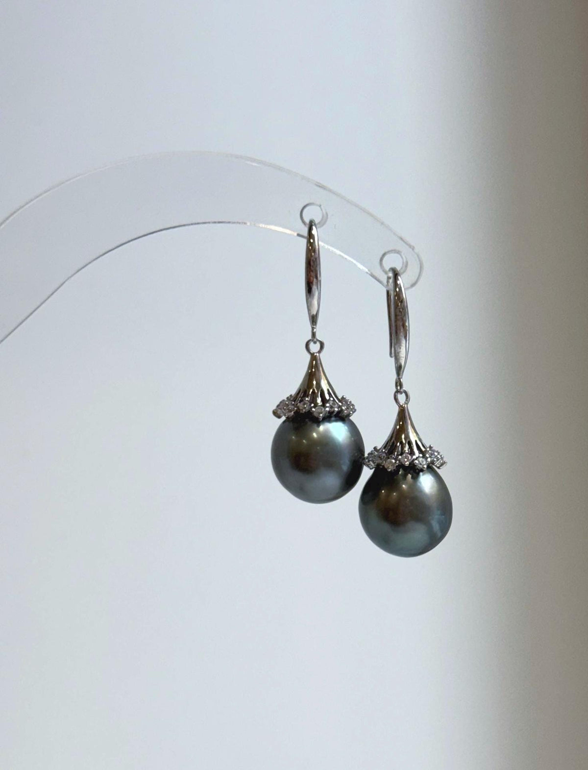 Lustrous gray pearl drops with sparkling floral caps