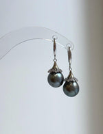 Lustrous gray pearl drops with sparkling floral caps