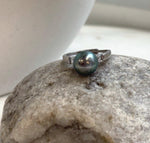 Vintage style Tahitian pearl ring with rich peacock green coloring.