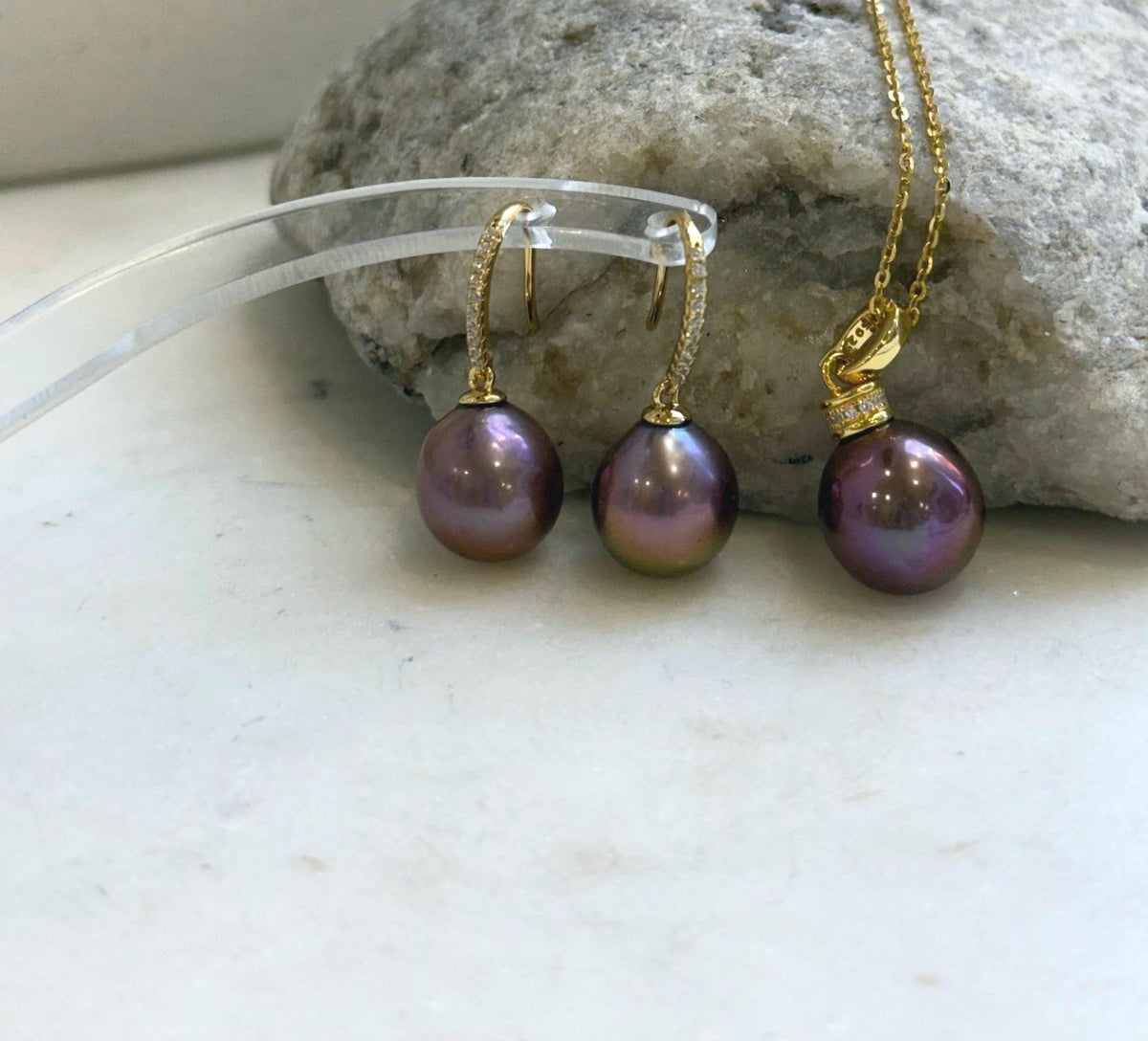 Raspberry rose pearls paired with sterling silver in a matching jewelry set.