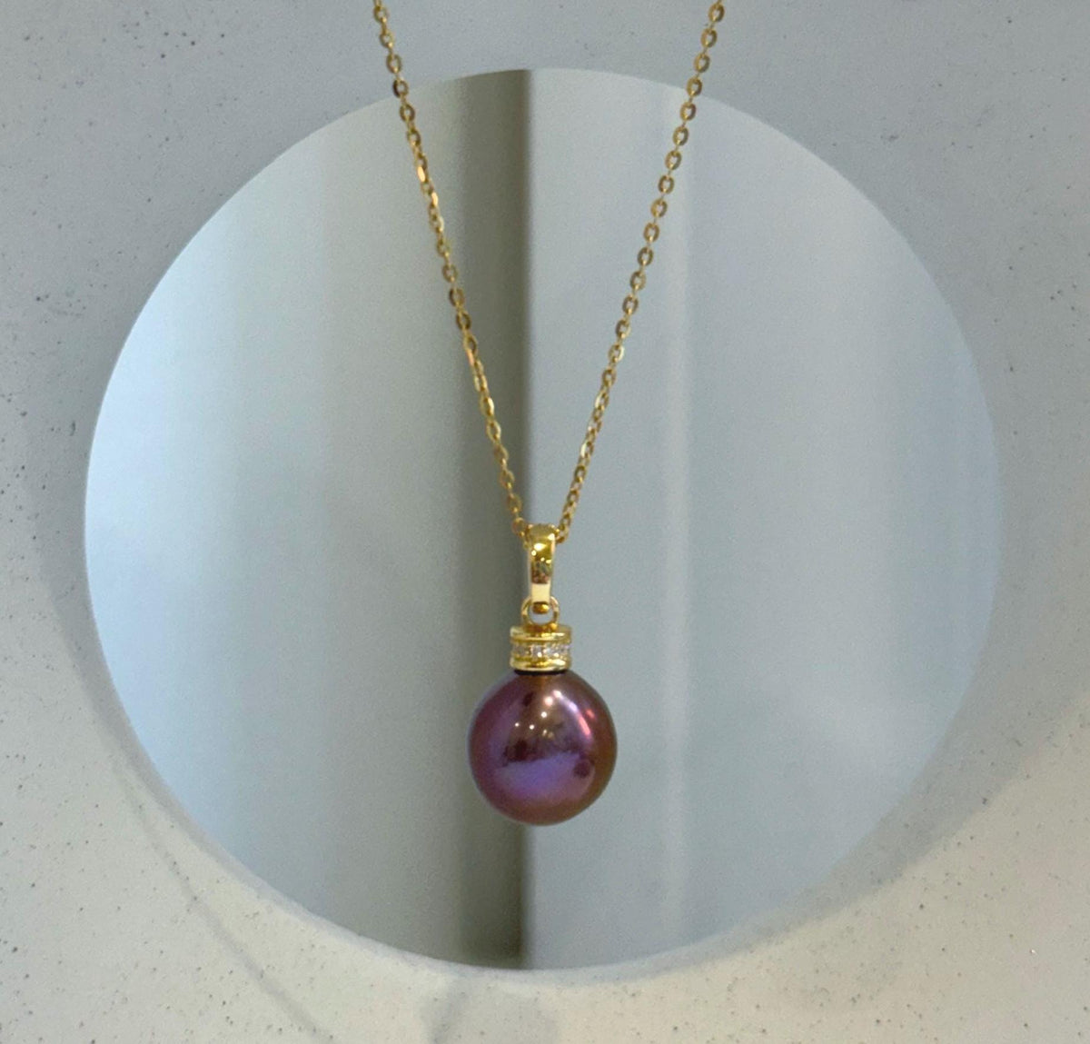Matching S925 sterling silver necklace and earrings featuring glossy rose-colored pearls.