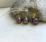 Rose raspberry pearl jewelry set with a pendant and matching earrings on silver hooks.