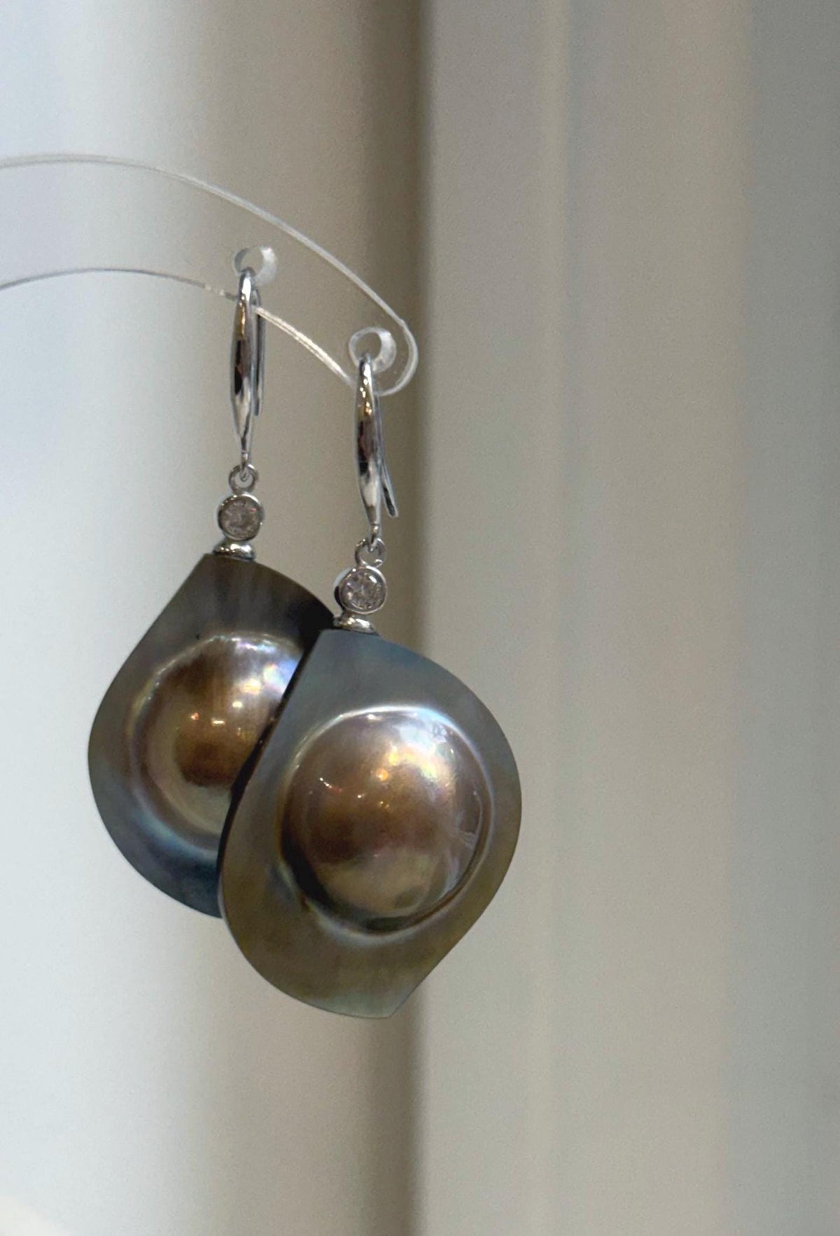 S925 silver earrings showcasing mirror-luster golden mabe pearls.