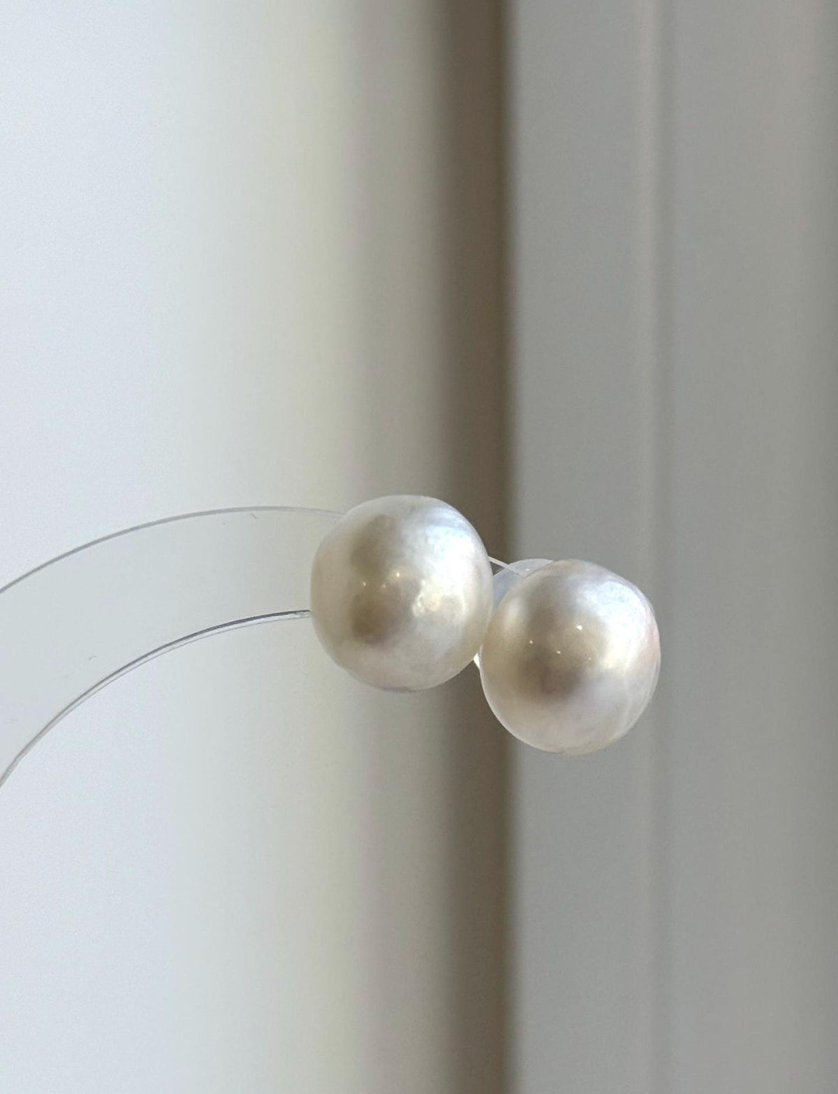 Australian white South Sea pearl stud earrings with mirror luster and S925 sterling silver settings.