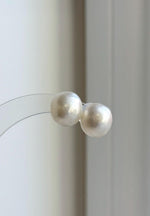 Genuine white saltwater pearl stud earrings set in S925 sterling silver.