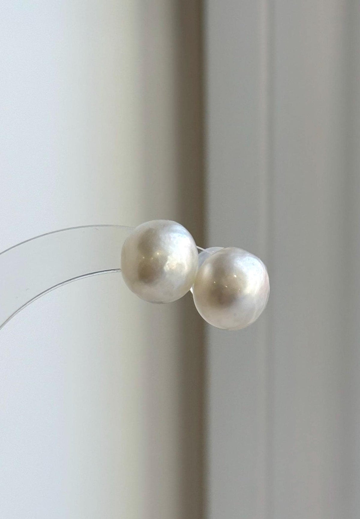 Genuine white saltwater pearl stud earrings set in S925 sterling silver.