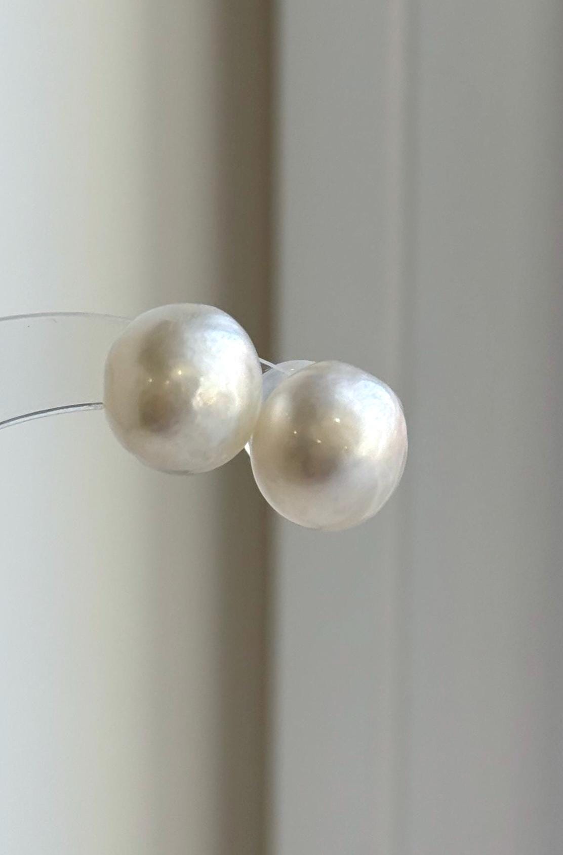 Classic Australian South Sea pearl earrings with soft white tones and bright luster.