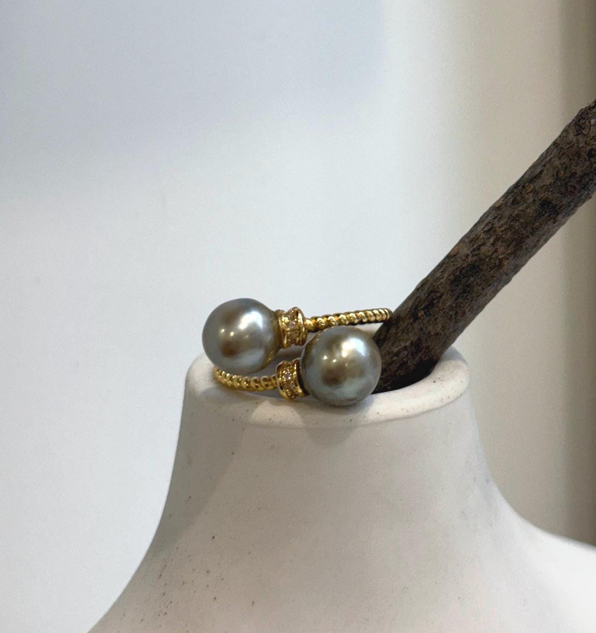 Lustrous taupe Tahitian pearls featured together in a sterling silver double pearl ring.
