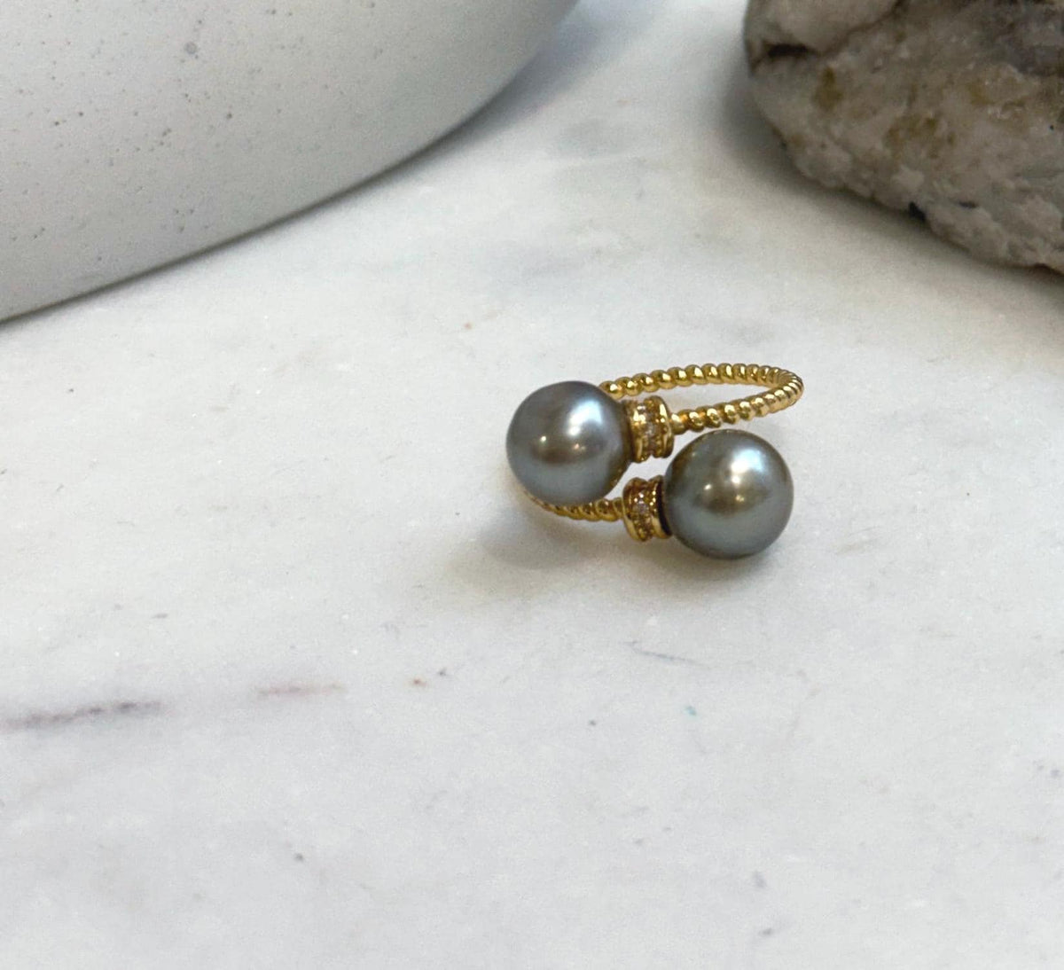 Adjustable sterling silver ring showcasing two genuine taupe saltwater pearls.