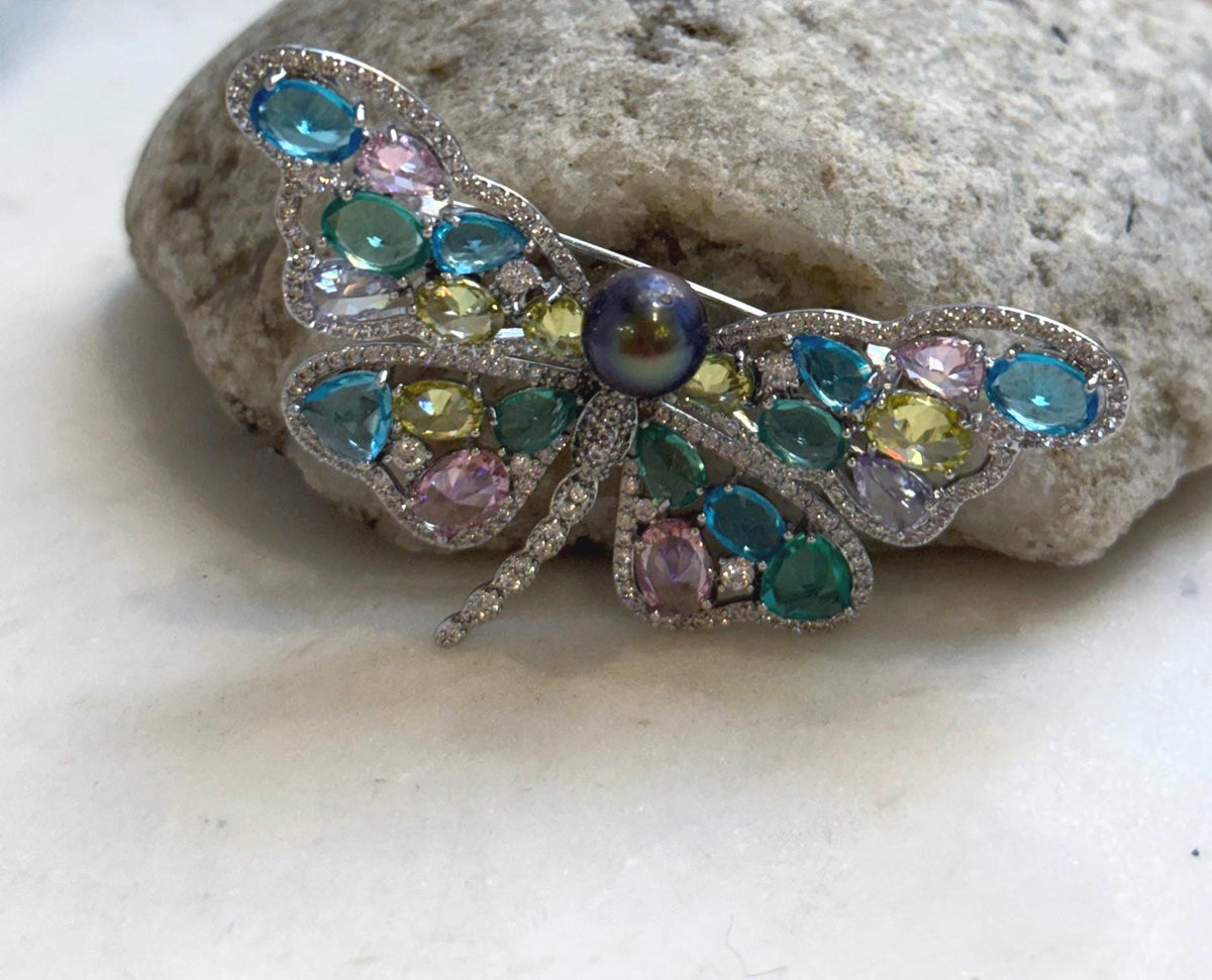 Genuine Tahitian pearl butterfly design with multicolor sparkle.