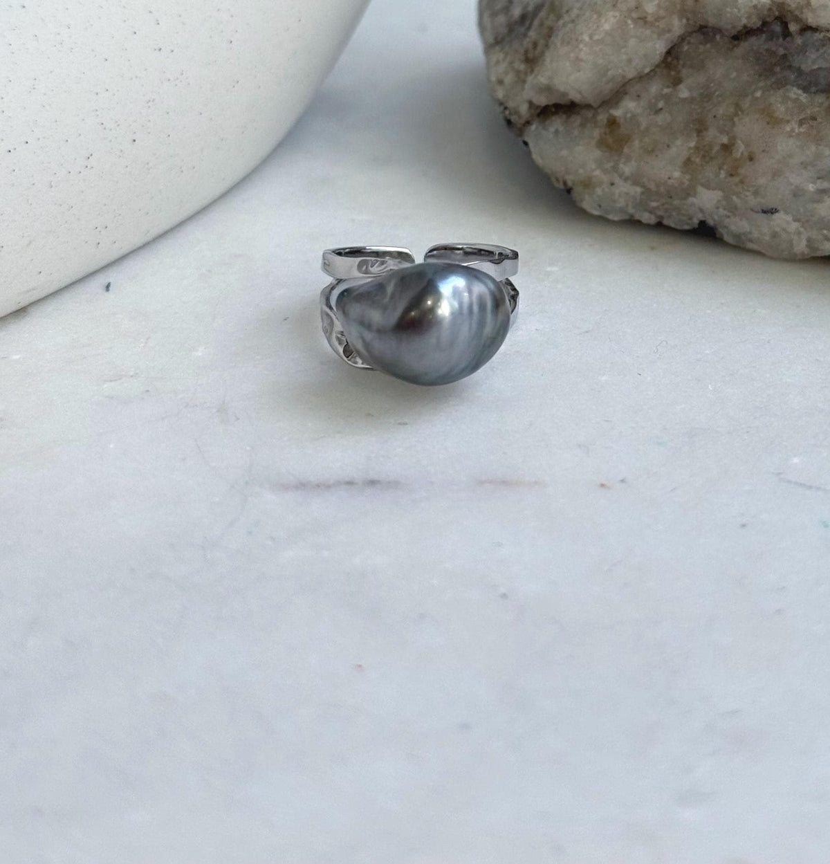 Platinum gray Tahitian keshi pearl set in a sterling silver ring.