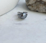 S925 sterling silver ring featuring a Tahitian keshi pearl with a reflective platinum gray surface.