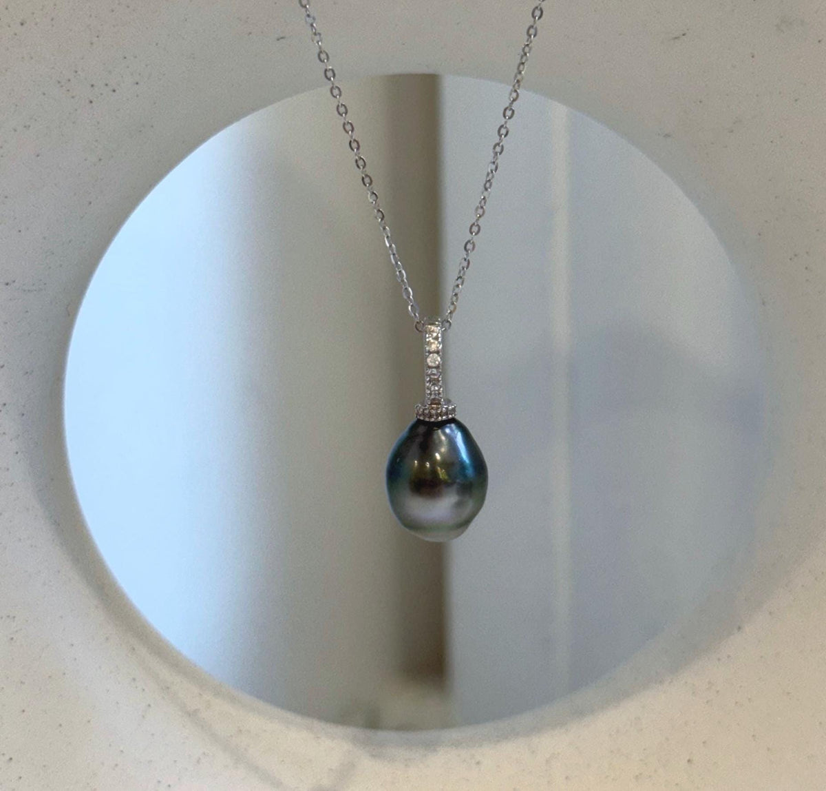 Hunter green and silver Tahitian pearl pendant with crystal-accented S925 sterling silver.
