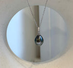 Genuine Tahitian pearl pendant with sparkling crystal accents and sterling silver detailing.
